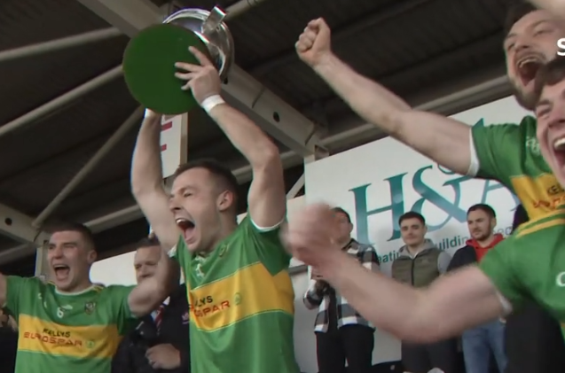 Conor Carville lifting the cup