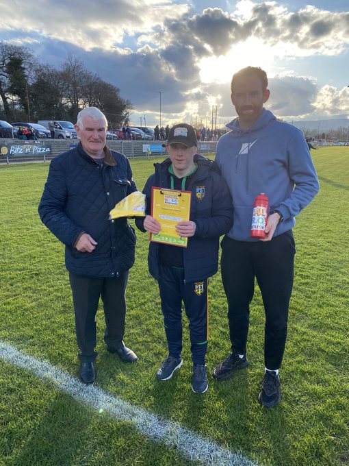 James receiving an award pack from John J and Conor Glass